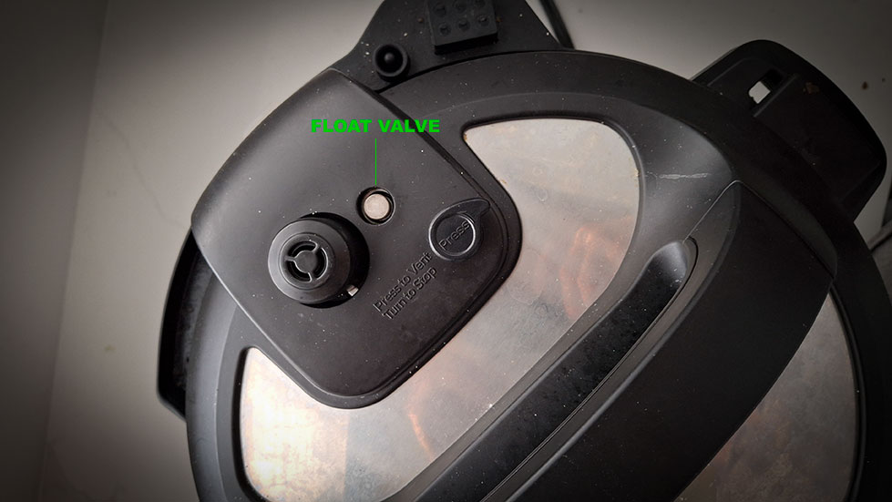 Float valve depicted on an Instant Pot. Sometimes steam will escape from there before the unit comes to pressure. It's completely normal in that case.