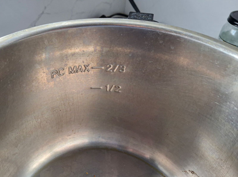 Overhead image of Instant Pot inner pot showing max fill line and safe fill level